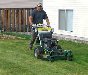 Dan Olson mowing lawn